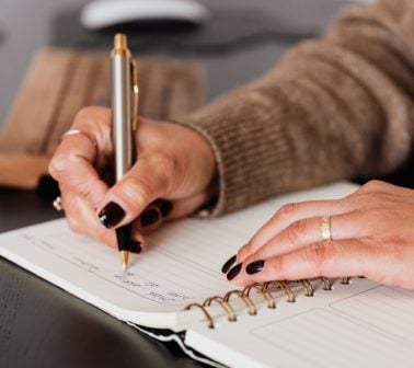 woman journaling her thoughts and gratitudes